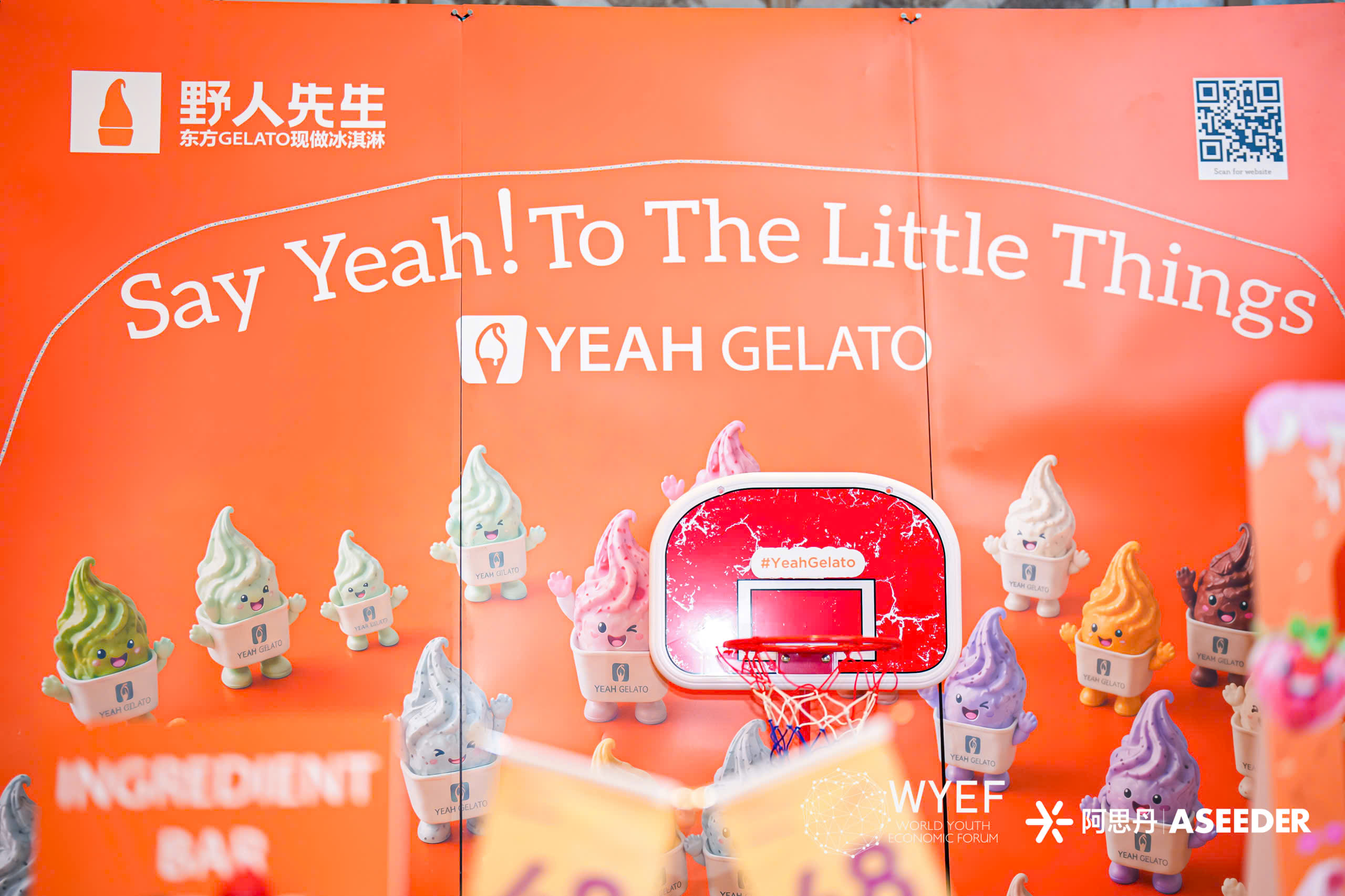 Yeah Gelato campaign installation with orange backdrop, gelato characters, and Say Yeah! To The Little Things headline