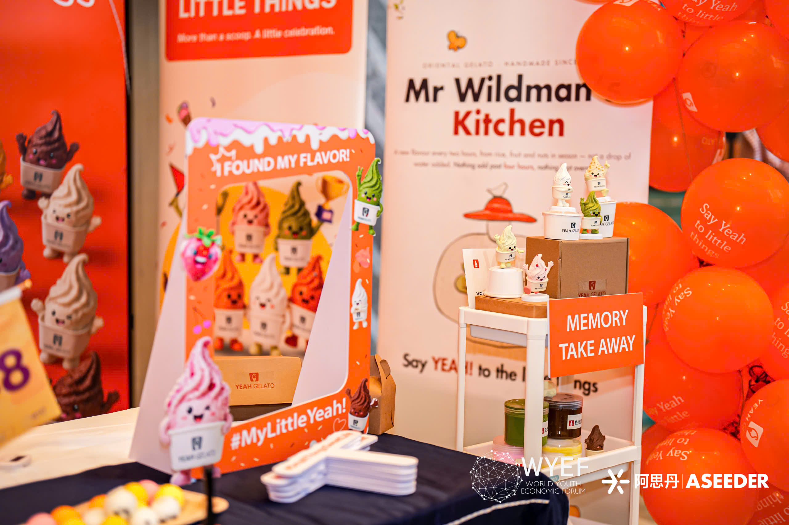 Yeah Gelato photo frame, orange balloons, and illustrated character display